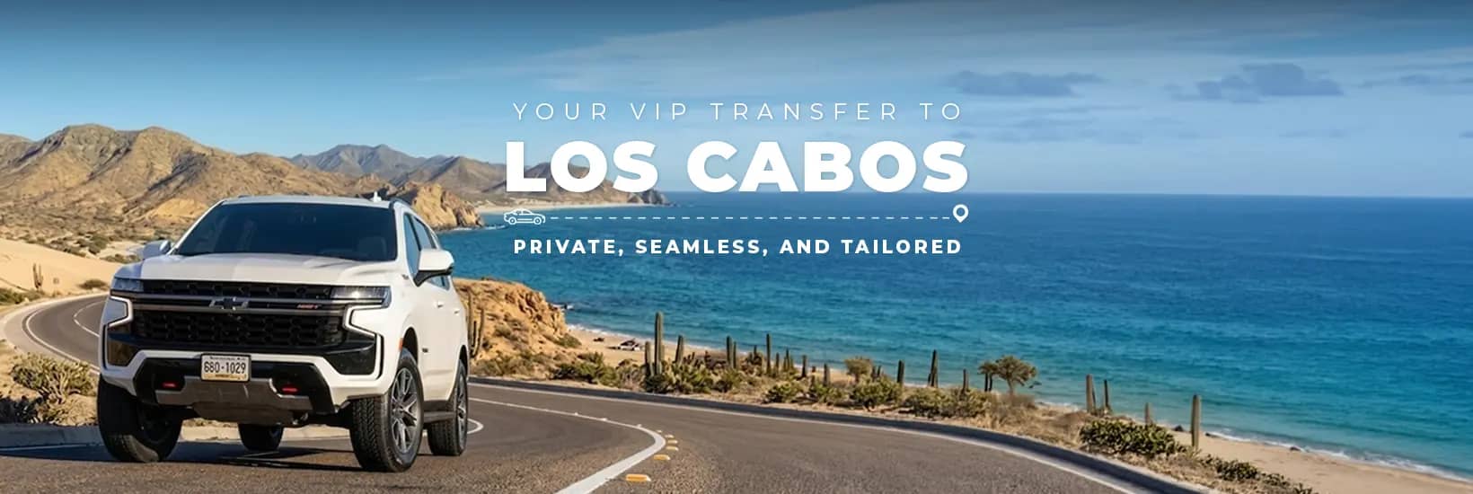 Fleet of TransVIP Suburban SUVs in a desert landscape of Los Cabos
